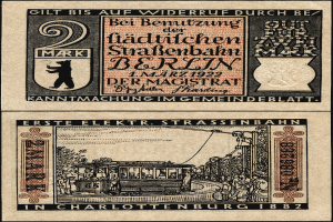 Eine alte deutsche Banknote mit einem Zug darauf und Text auf dem Papier.