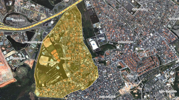 Eine Luftaufnahme einer Stadt mit Gebäuden, Straßen und Grünflächen, die eine zentrale Karte eines geplanten Baugebiets zeigt.