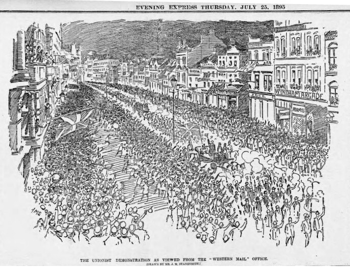 Schwarze und weiße Zeichnung einer Menge, die eine Straße zwischen Gebäuden entlanggeht, mit Text oben und unten, der "Die Unionistendemonstration aus der Sicht des Western Mail Office" lautet.