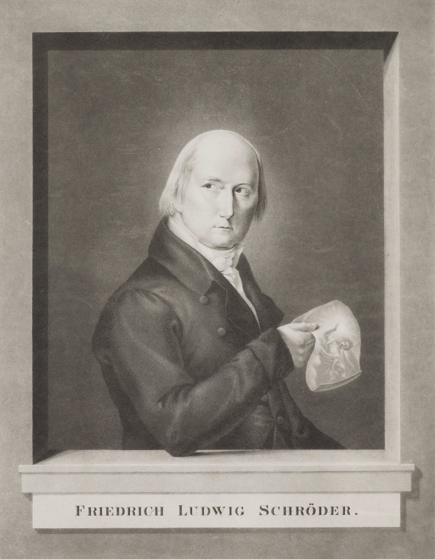 Ein Schwarz-Wei├č-Foto von Friedrich Ludwig Schr├Âder, einem deutschen Komponisten, der einen Anzug tr├Ągt und ein Blatt Papier in der Hand h├Ąlt, mit einem ernsten Gesichtsausdruck und konzentriertem Blick.